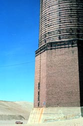 Anaconda Smoke Stack next to car