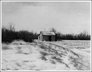 Homesteader cabin on the open plain.